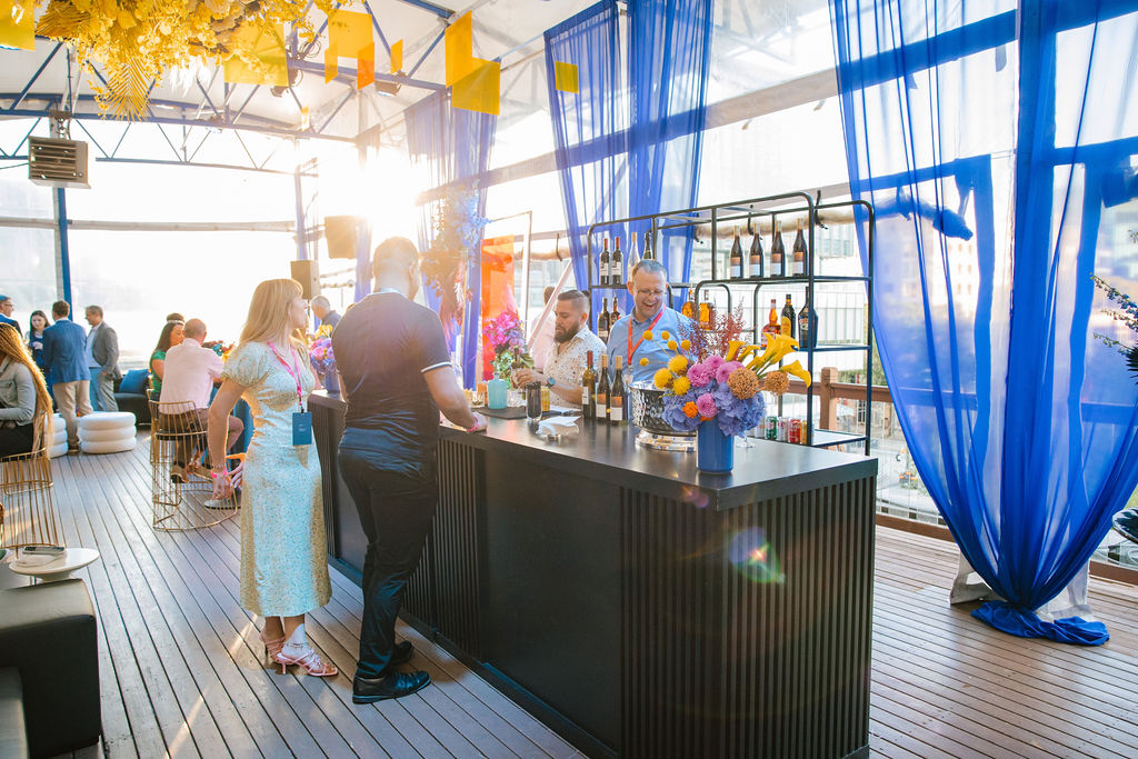 An event with a bar is hosted on the Gallery's Rooftop Pavilion